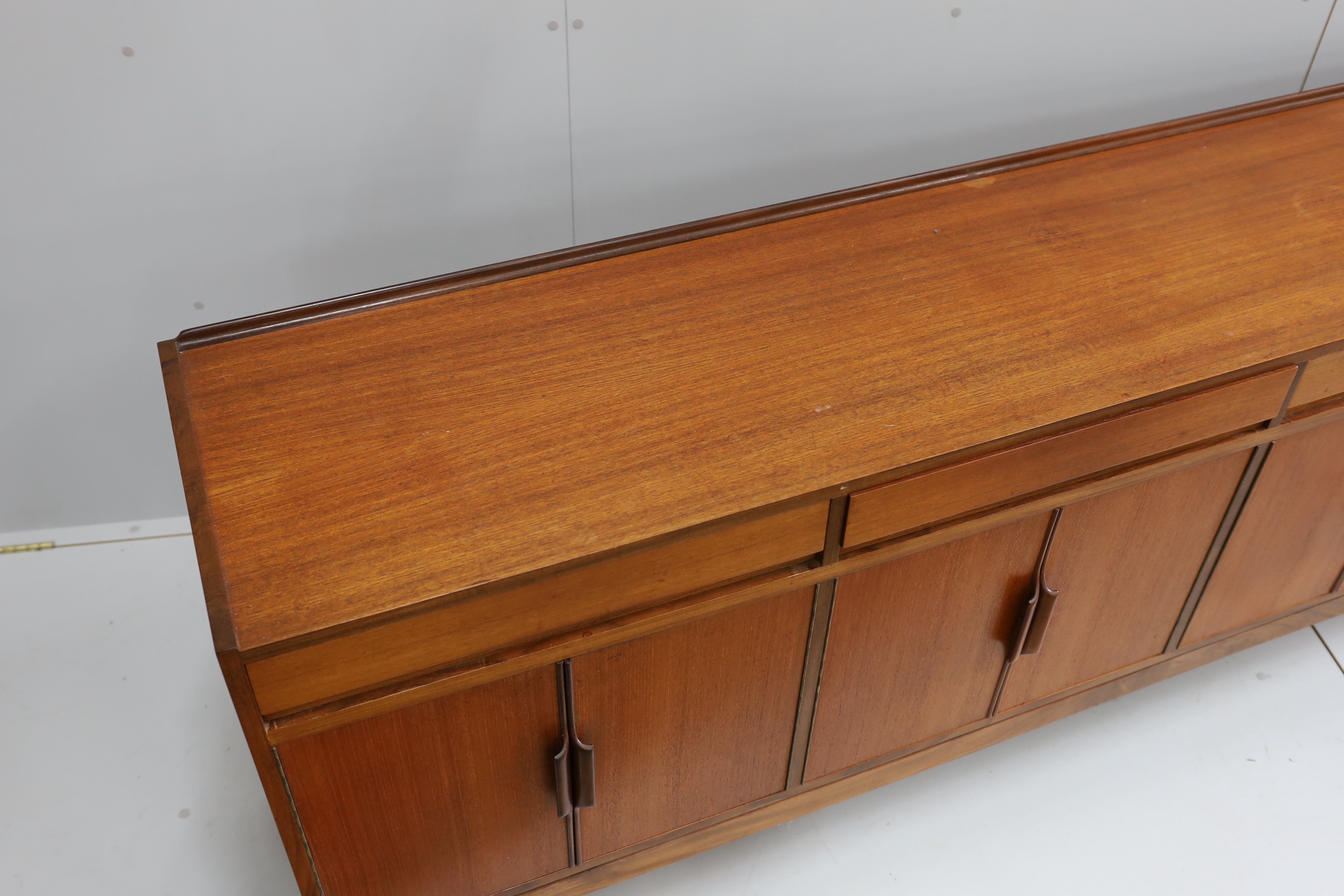 Robert Heritage for Archie Shine, a mid century teak sideboard, length 238cm, depth 46cm, height 86cm